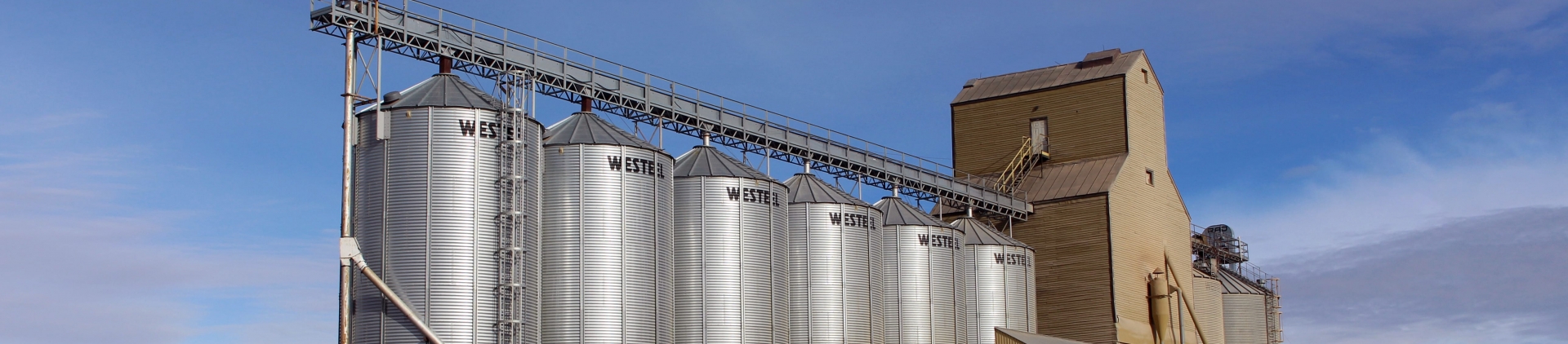 Silos against a blue sky.