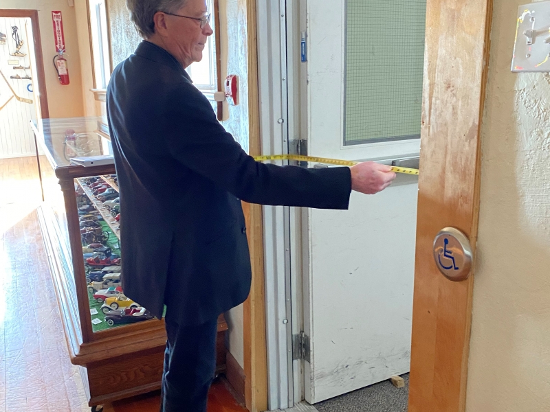 Barry measuring a door frame